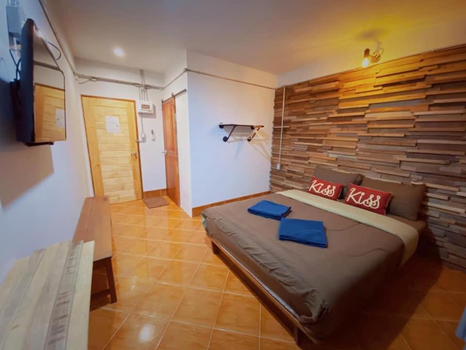 a bedroom with a large bed in a room at Pakarang Resort in Satun