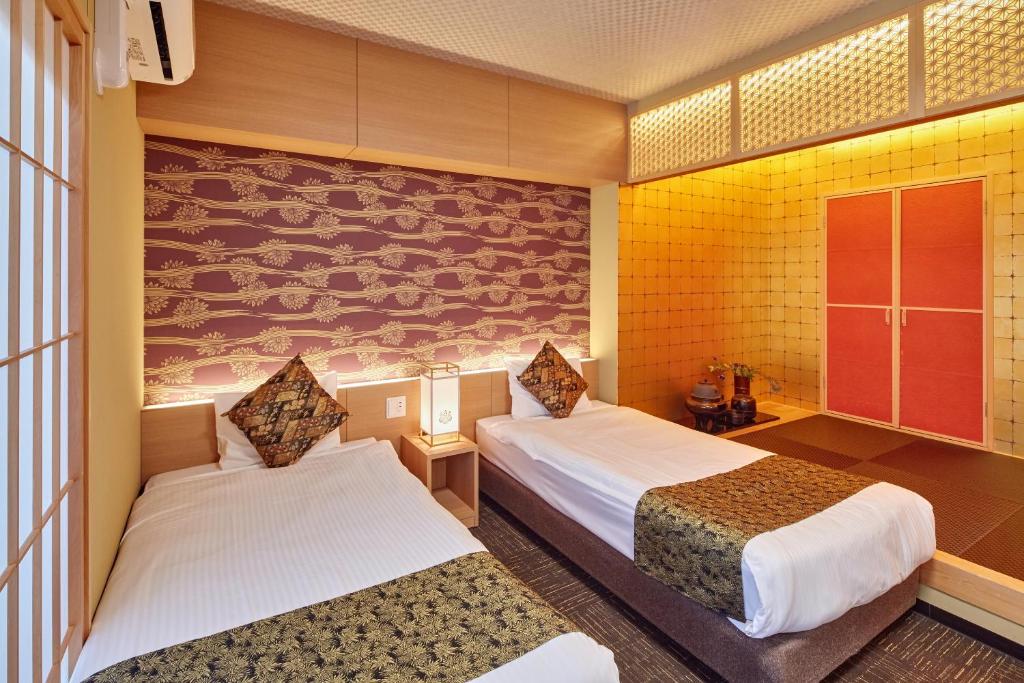 Postel nebo postele na pokoji v ubytování Hotel Amaterrace Nippombashi-higashi