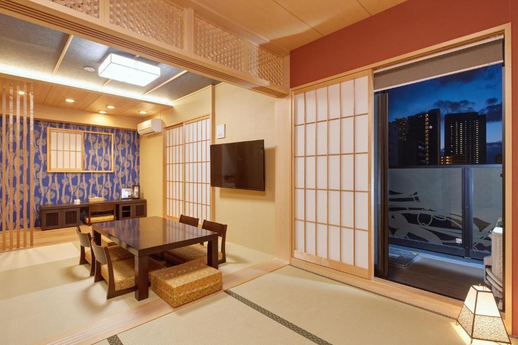 TV a/nebo společenská místnost v ubytování Hotel Amaterrace Nippombashi-higashi