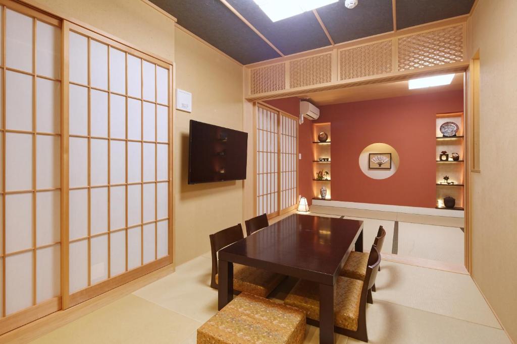 TV a/nebo společenská místnost v ubytování Hotel Amaterrace Nippombashi-higashi