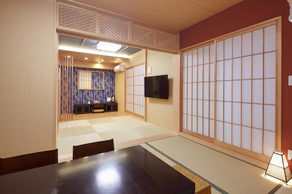 TV a/nebo společenská místnost v ubytování Hotel Amaterrace Nippombashi-higashi