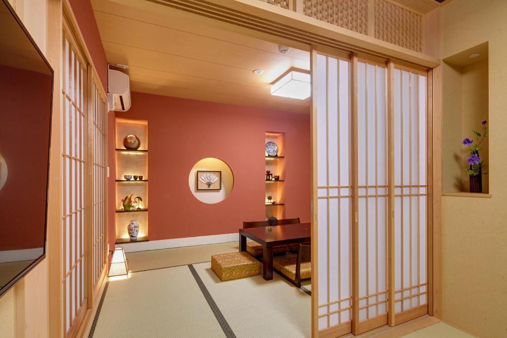 Postel nebo postele na pokoji v ubytování Hotel Amaterrace Nippombashi-higashi