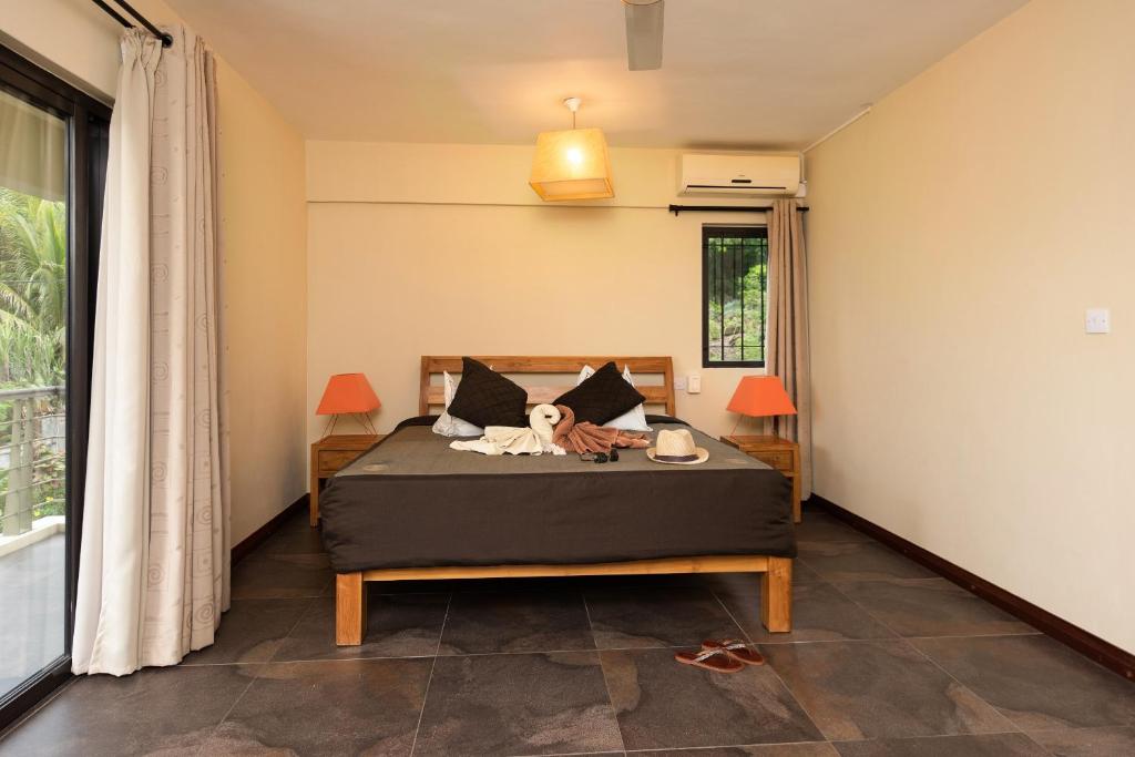 Postel nebo postele na pokoji v ubytování Happy Days Guest House