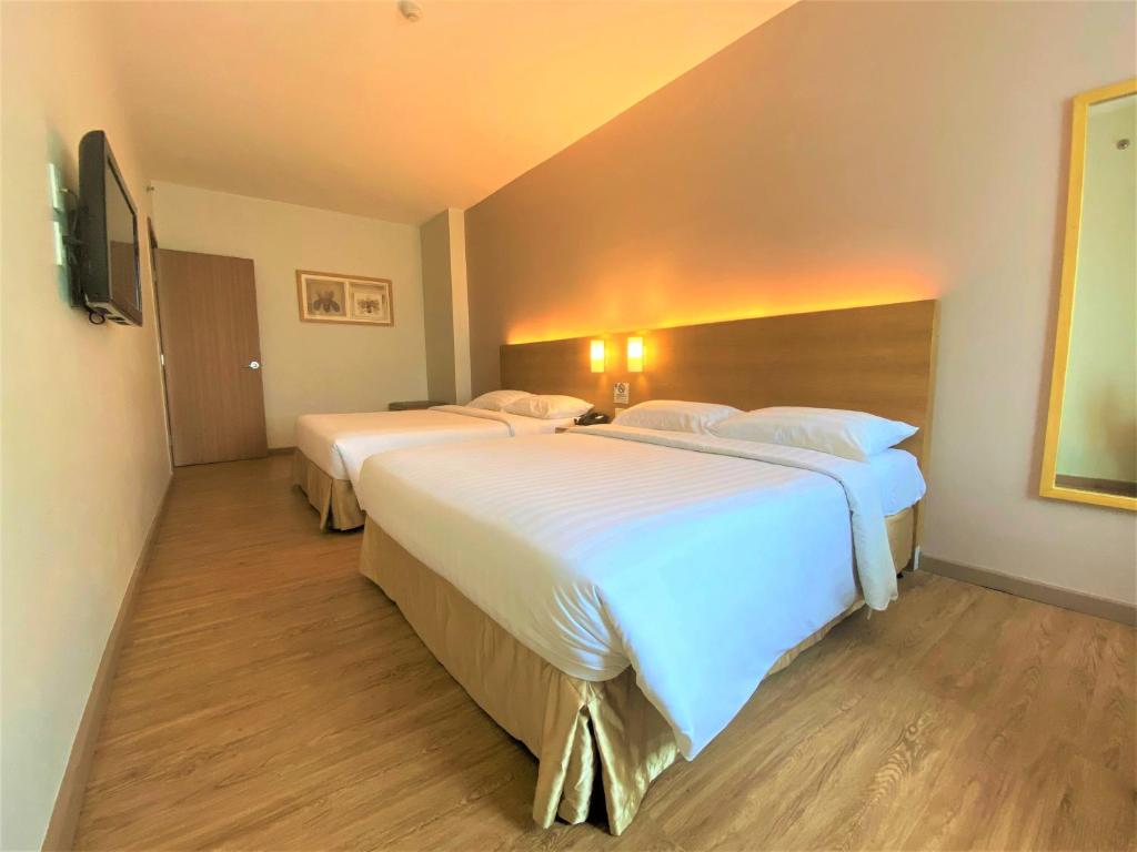 Llit o llits en una habitació de One Pacific Place Serviced Residences