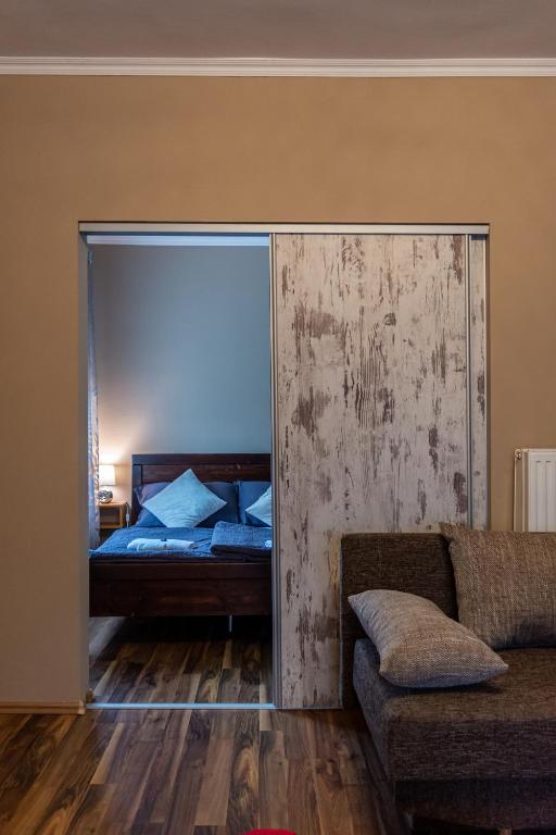 Postel nebo postele na pokoji v ubytování Virág Vendégház
