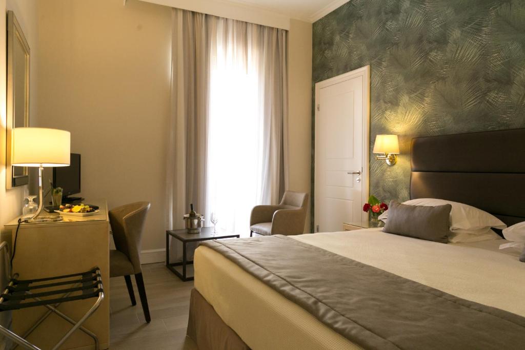 Postel nebo postele na pokoji v ubytování Thermae Sylla Spa & Wellness Hotel