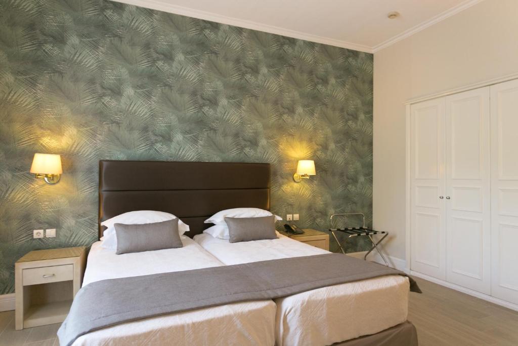 Postel nebo postele na pokoji v ubytování Thermae Sylla Spa & Wellness Hotel