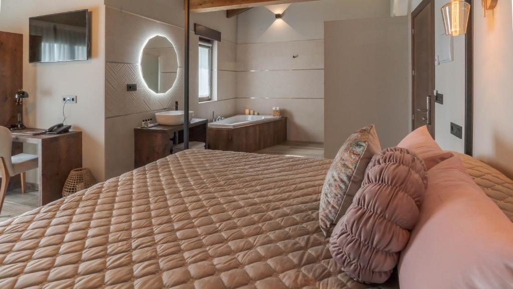 Cama o camas de una habitación en Hotel Rural Cantexos