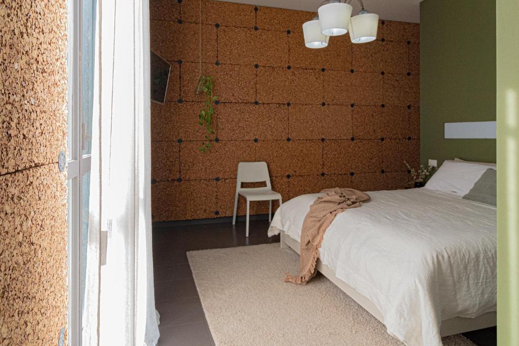 A bed or beds in a room at Lotus House