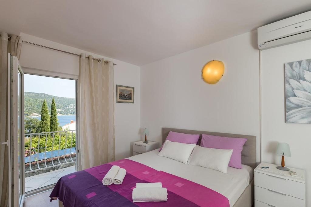 Posteľ alebo postele v izbe v ubytovaní Apartments & Room Eva Slano