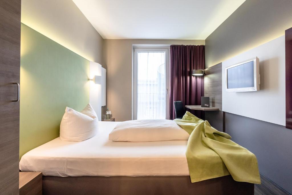 Postel nebo postele na pokoji v ubytování Hotel Demas City