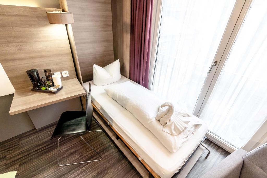 Postel nebo postele na pokoji v ubytování Hotel Demas City