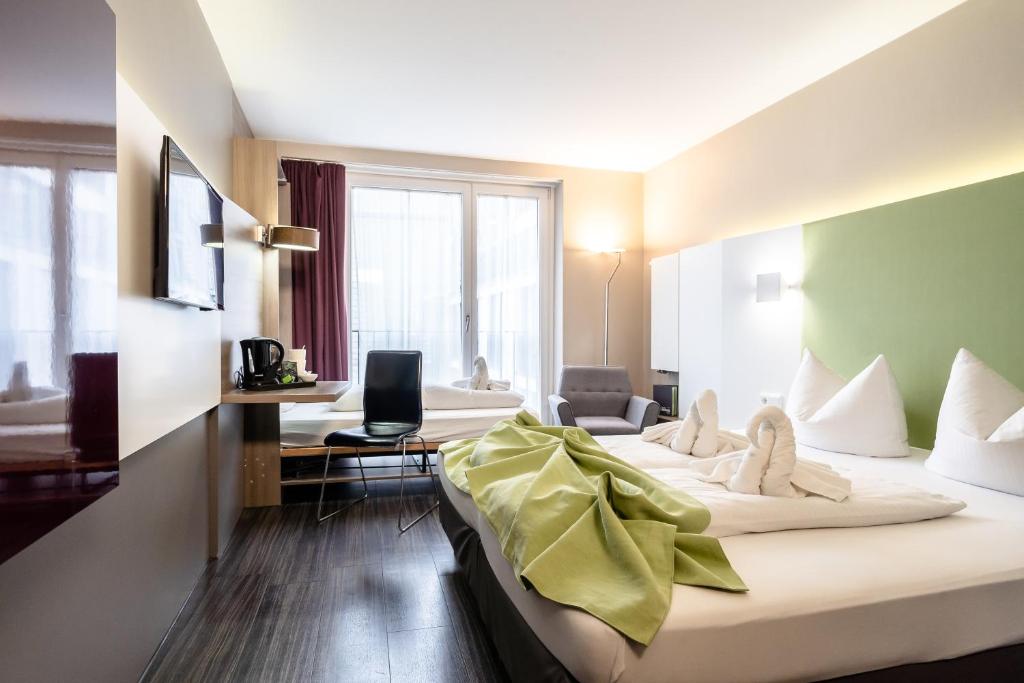 Postel nebo postele na pokoji v ubytování Hotel Demas City