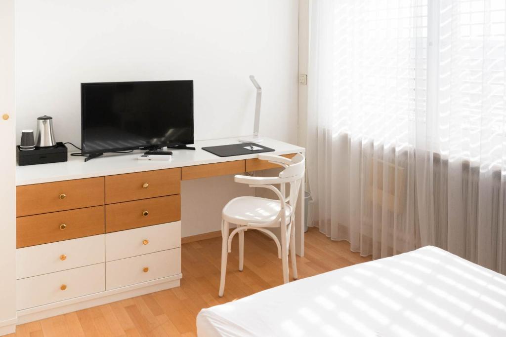 TV a/nebo společenská místnost v ubytování Aparthome L.I.N.Z.