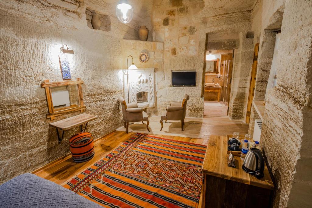 Televiisor ja/või meelelahutuskeskus majutusasutuses Sultan Cave Suites