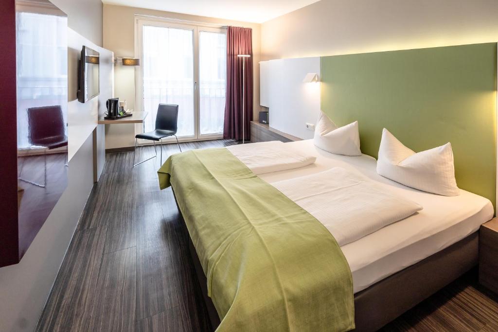 Postel nebo postele na pokoji v ubytování Hotel Demas City
