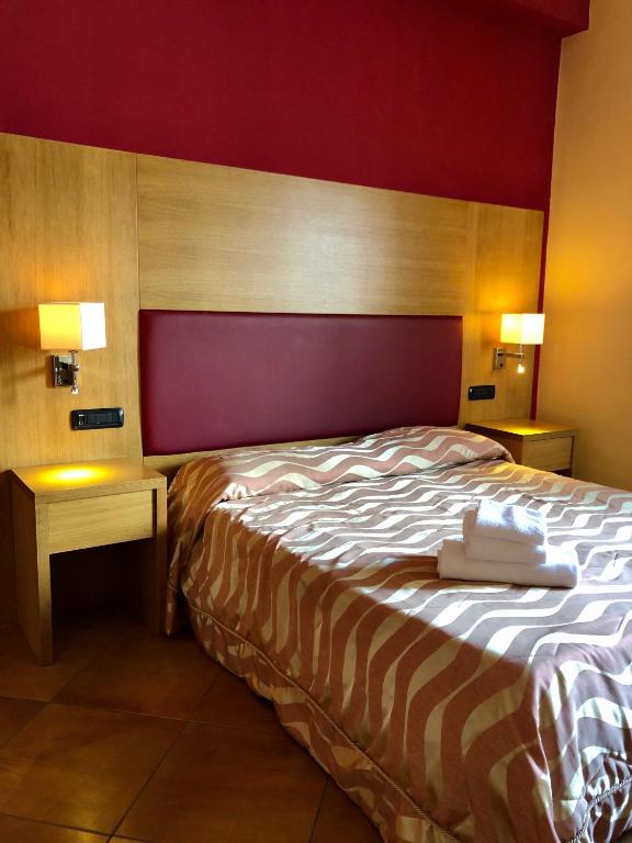 Postel nebo postele na pokoji v ubytování Mingone Hotel Ristorante