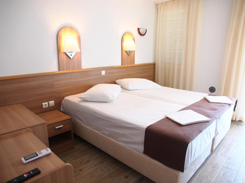 Postel nebo postele na pokoji v ubytování Hotel Aurora