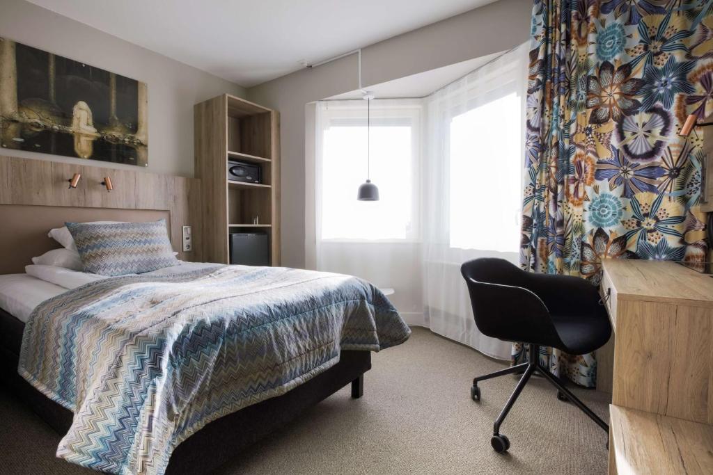 Postel nebo postele na pokoji v ubytování Best Western Plus John Bauer Hotel