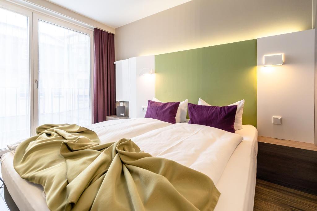 Postel nebo postele na pokoji v ubytování Hotel Demas City
