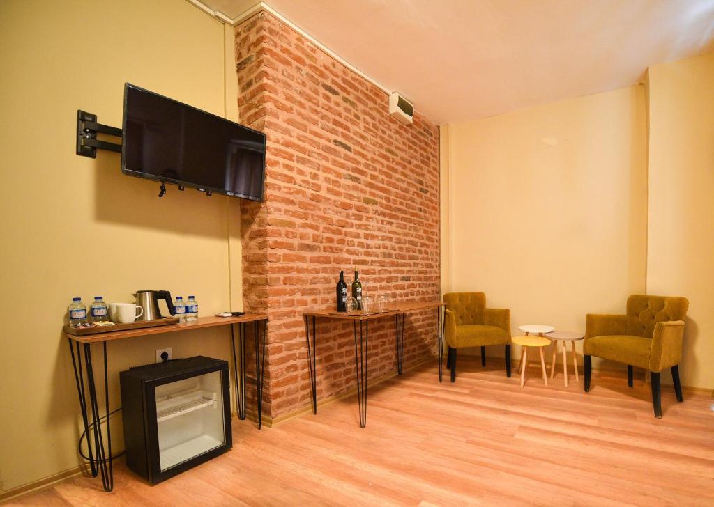 TV a/nebo společenská místnost v ubytování Maravilloso Hotel Pera