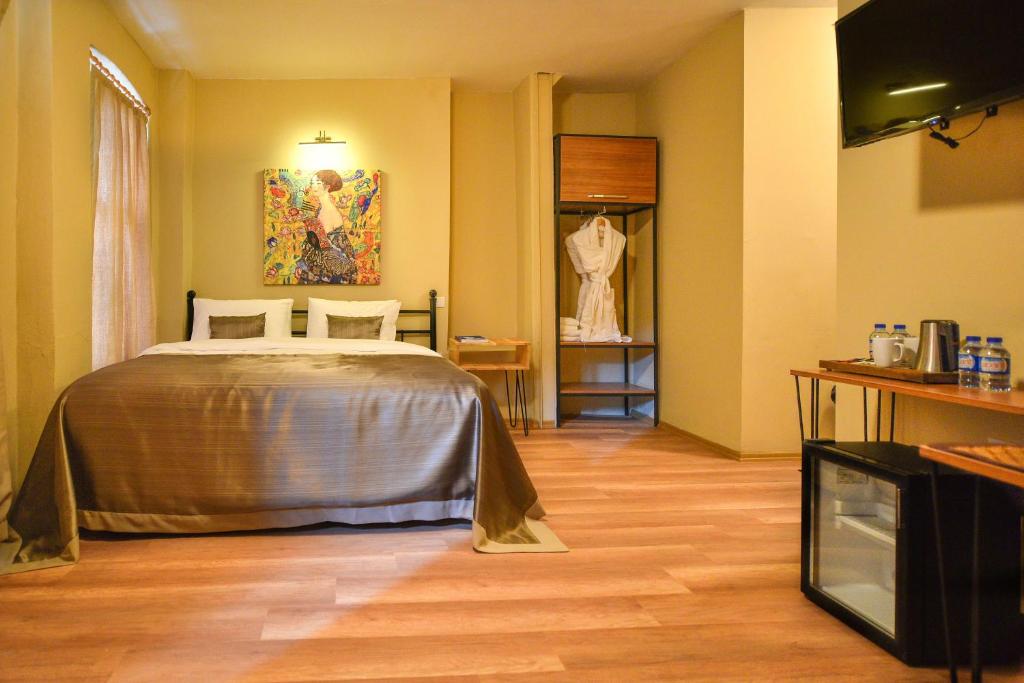 Postel nebo postele na pokoji v ubytování Maravilloso Hotel Pera