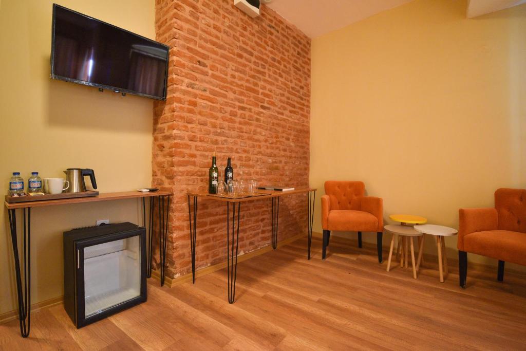 TV a/nebo společenská místnost v ubytování Maravilloso Hotel Pera