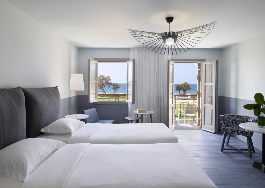 Кровать или кровати в номере Kalimera Kriti Hotel & Village Resort