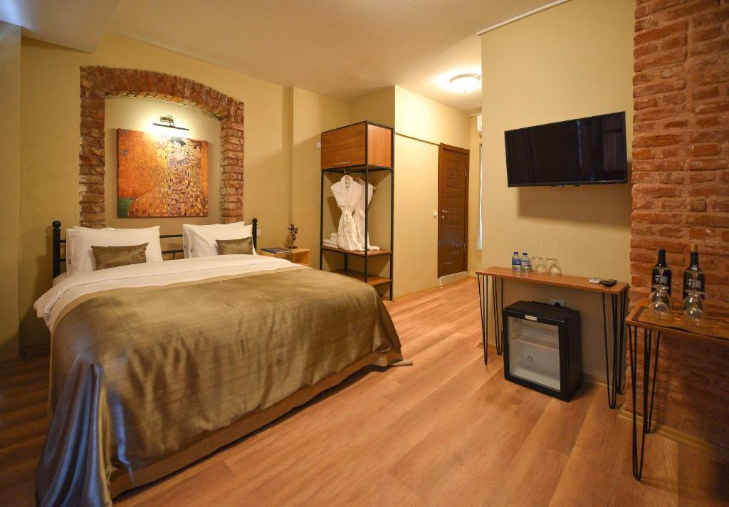 Postel nebo postele na pokoji v ubytování Maravilloso Hotel Pera