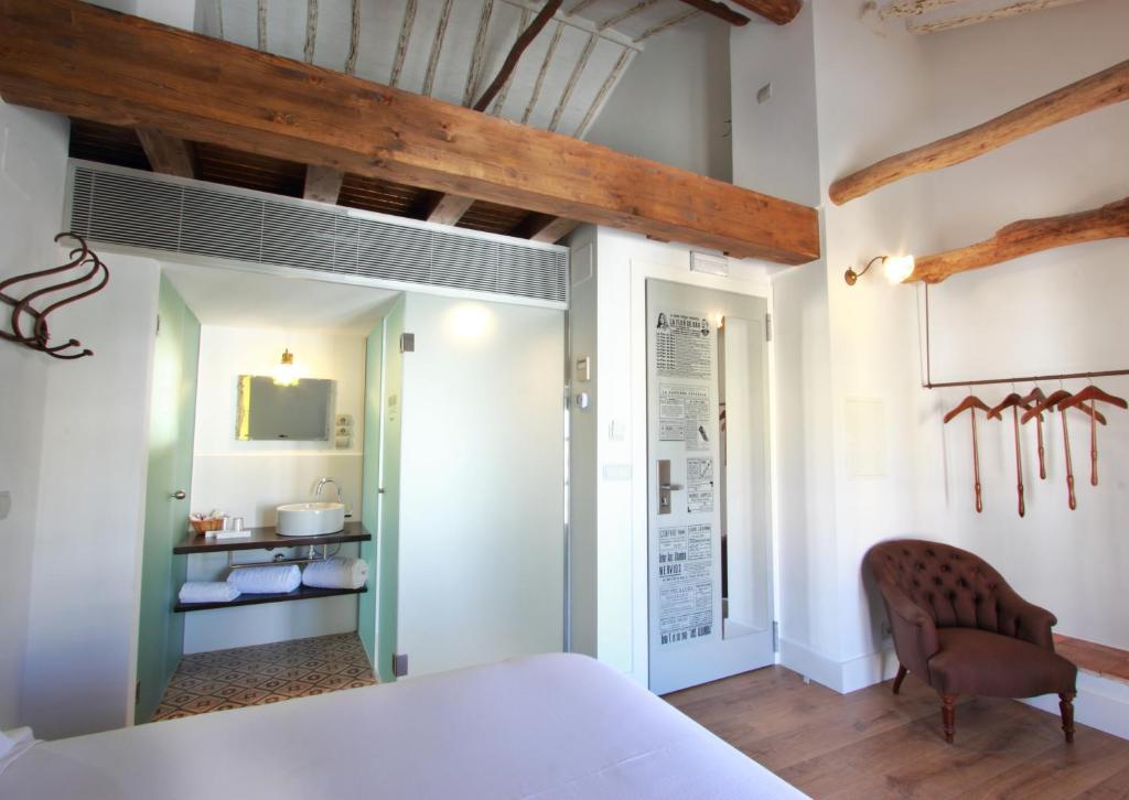 A bed or beds in a room at Hotel Patria Chica