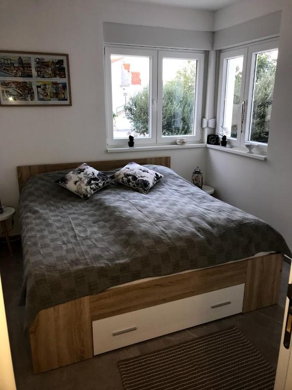 Postel nebo postele na pokoji v ubytování Villa Primosten