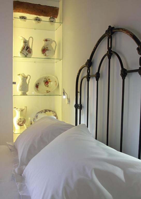 A bed or beds in a room at Hotel Patria Chica