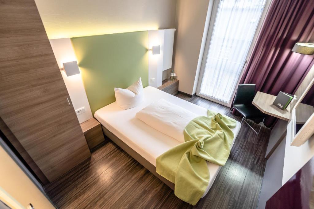 Postel nebo postele na pokoji v ubytování Hotel Demas City