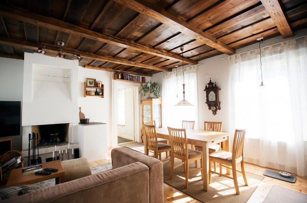 a living room with a dining room table and chairs at Dream Cottage in Center - AinaBnb - Residence Kappsäcken in Vaasa