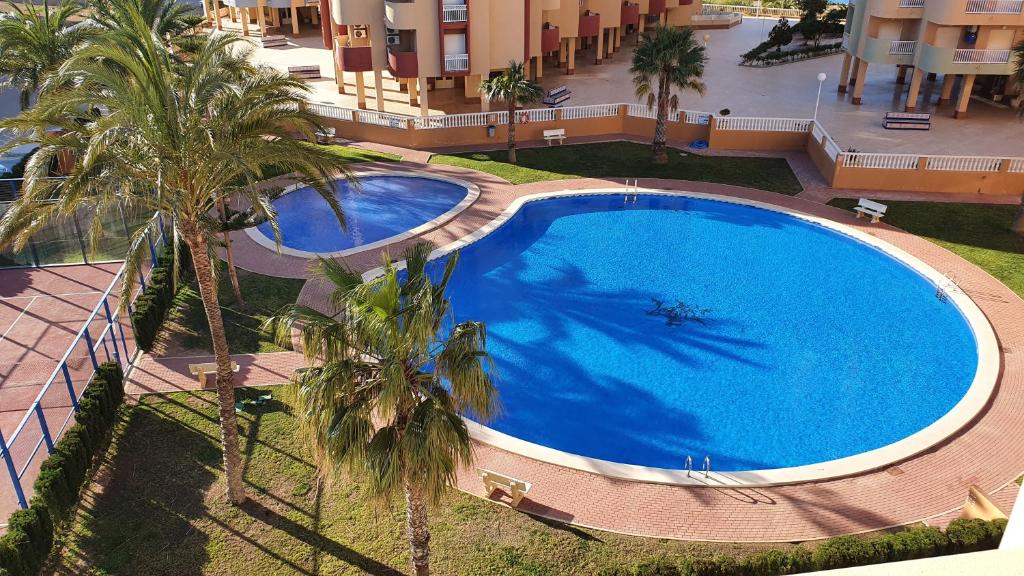 The swimming pool at or close to Apartamento ÁTICO SOL Los Miradores del Puerto