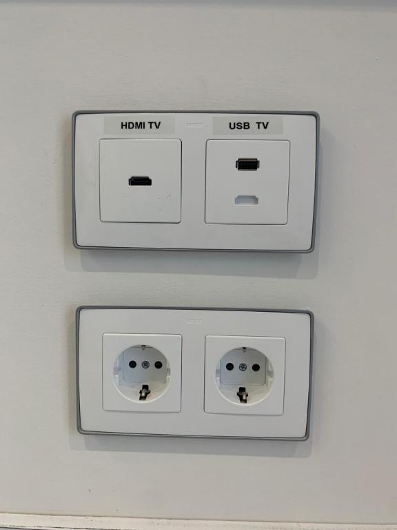 two electrical outlets on a white wall at Nerja Casual Rooms in Nerja