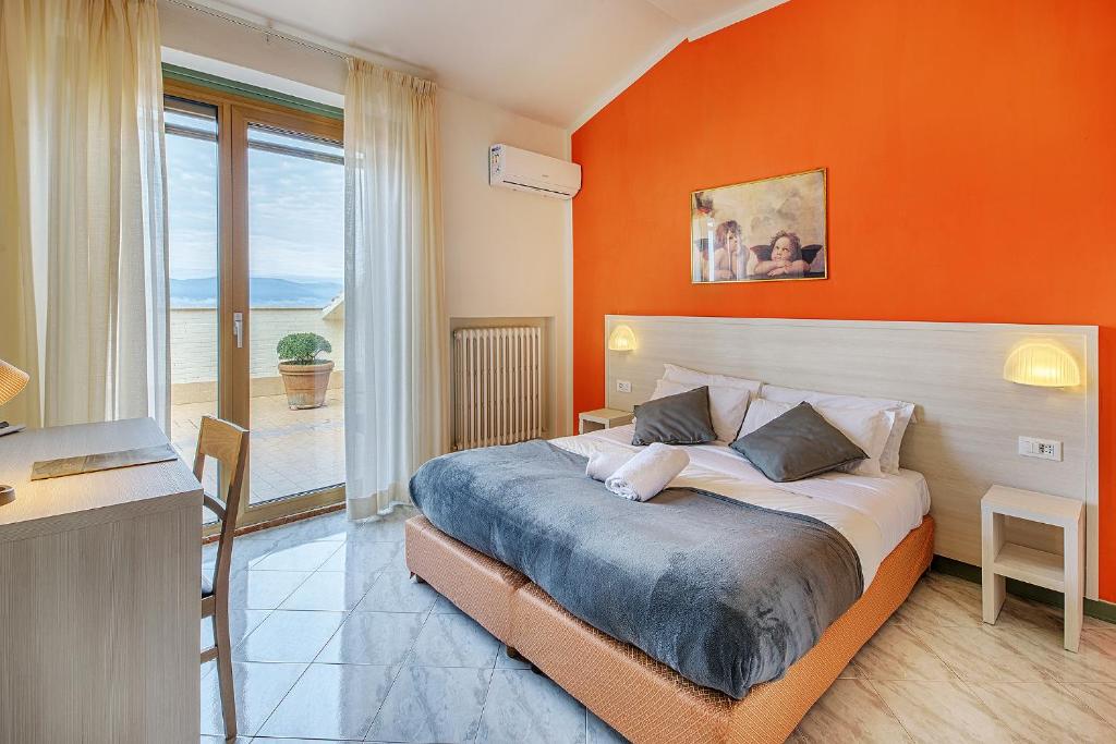 Postel nebo postele na pokoji v ubytování Hotel Castello