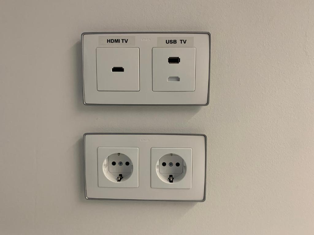 two light switches on a wall with the words happy and uses iv at Nerja Casual Rooms in Nerja