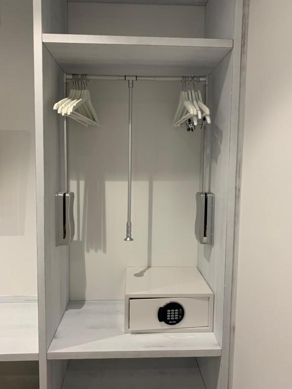 a bathroom with a shower with a sink at Nerja Casual Rooms in Nerja