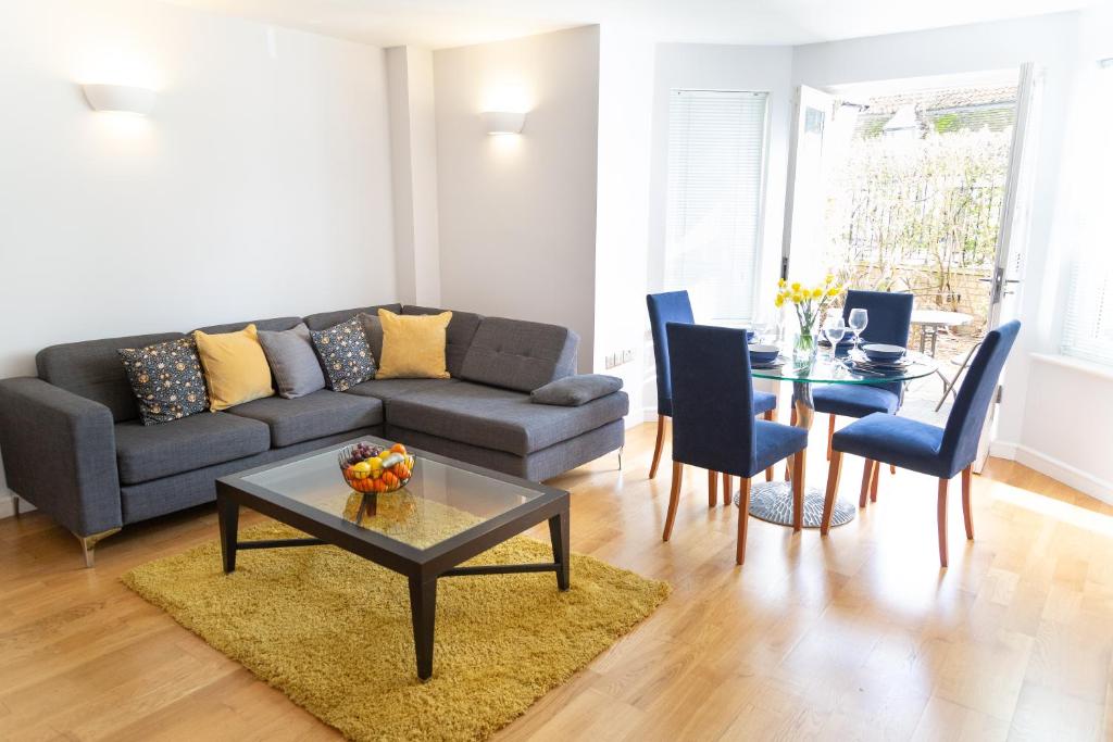 a living room with a couch and a table at Citystay - Marino Place in Cambridge