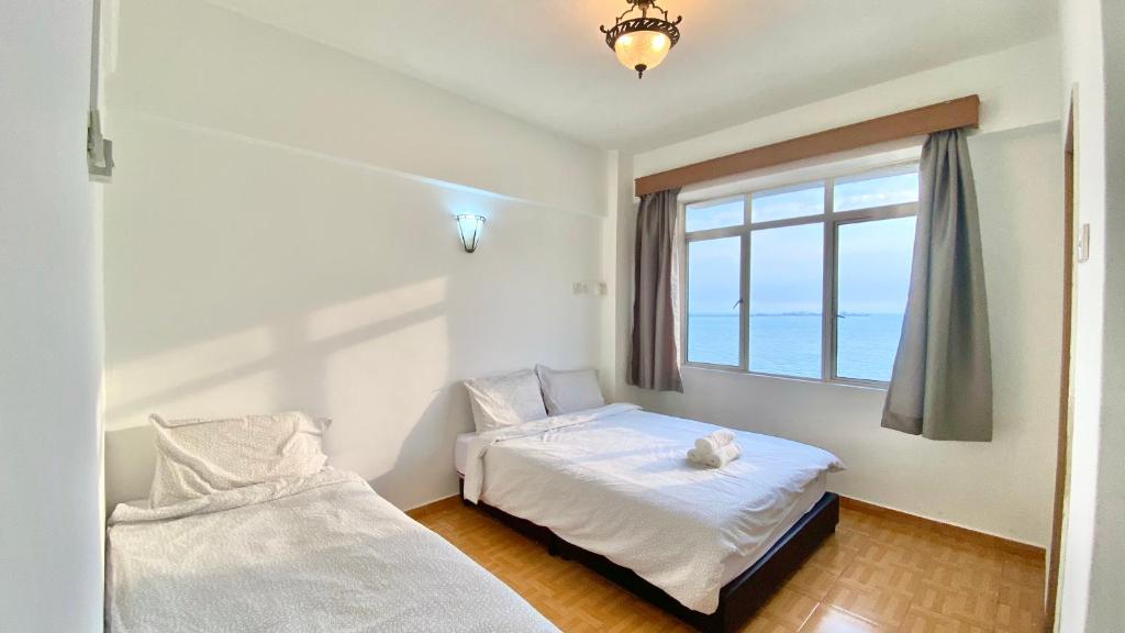 Postel nebo postele na pokoji v ubytování Maison Seaview Suites Port Dickson