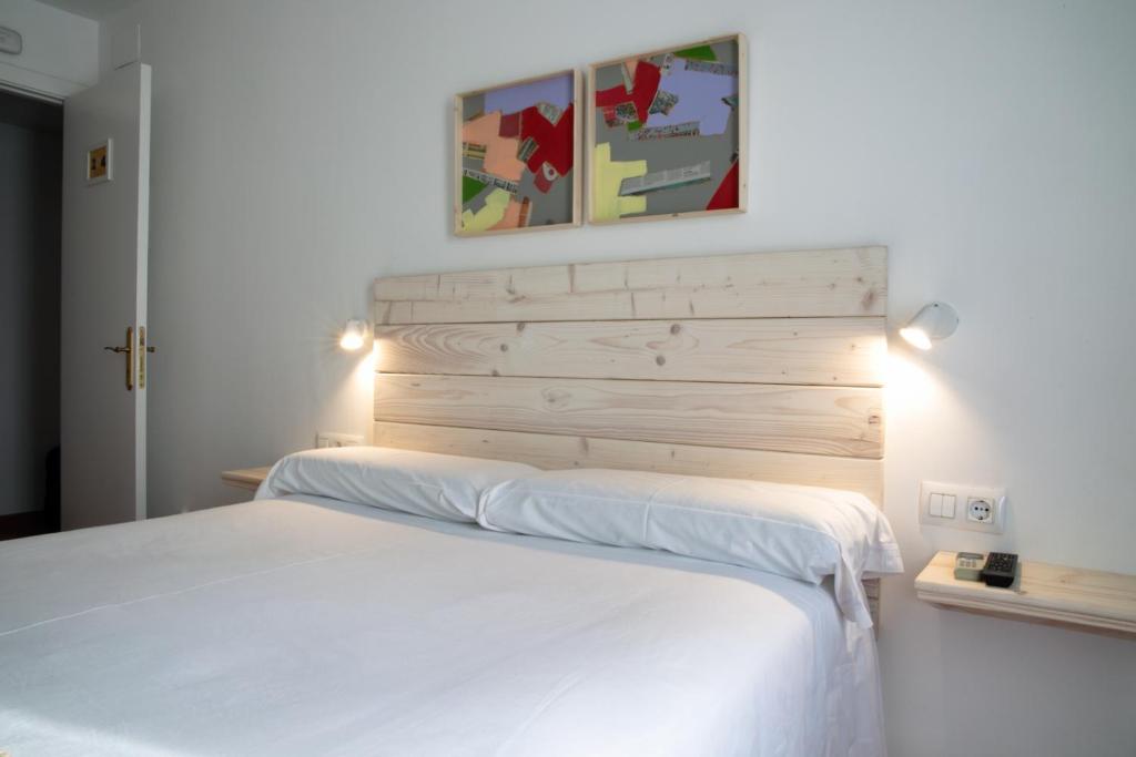 Posteľ alebo postele v izbe v ubytovaní Hotel 3 Arcs
