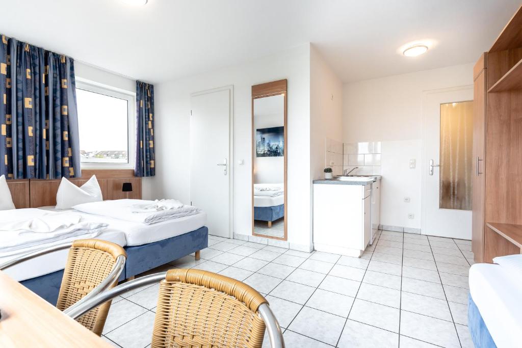 Postel nebo postele na pokoji v ubytování Hotel Fresh INN