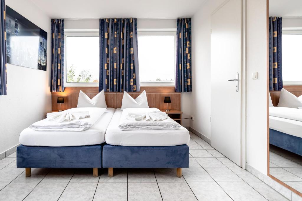 Postel nebo postele na pokoji v ubytování Hotel Fresh INN