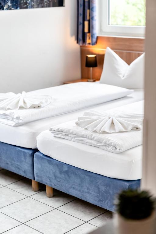 Postel nebo postele na pokoji v ubytování Hotel Fresh INN