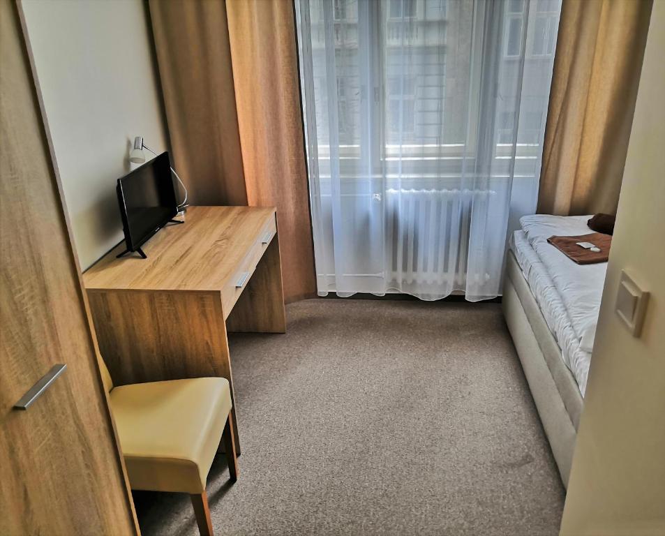 TV a/nebo společenská místnost v ubytování Hotel Marianeum