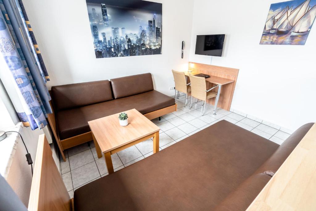 TV a/nebo společenská místnost v ubytování Hotel Fresh INN