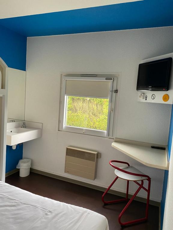 Postel nebo postele na pokoji v ubytování Hôtel F1 Verdun