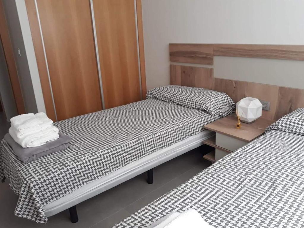 En eller flere senger på et rom på Sukha Nara Apartment 47