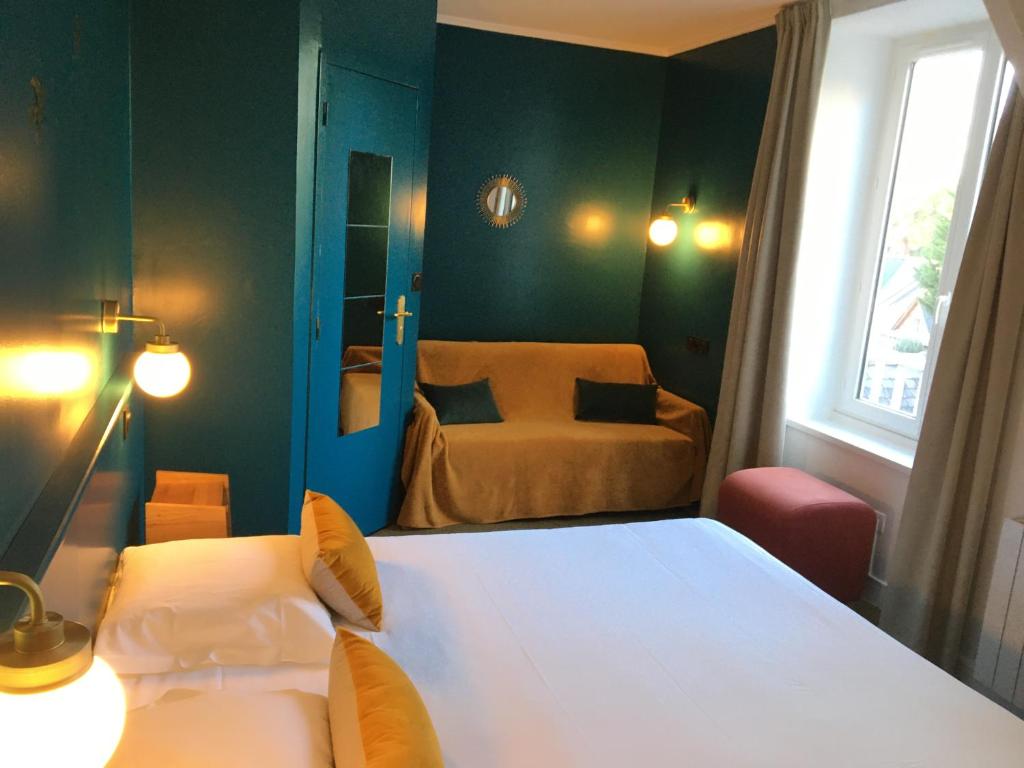 Postel nebo postele na pokoji v ubytování Hotel du Parc